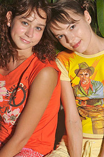 Two sweet teen girlfriends posing-00